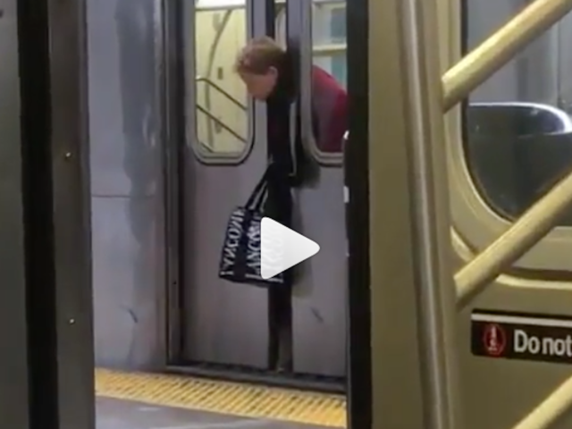 Riders Walk Past Woman with Head Trapped Between Subway Doors Riders Walk Past Woman with Head Trapped Between Subway Doors